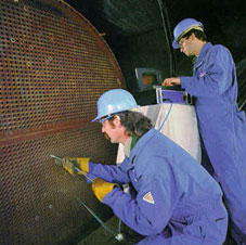 Inspectors use eddy current NDT to inspect heat exchanger pipes.