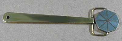 The pie gage is a disk of highly permeable material divided into four, six, or eight sections by nonferromagnetic material. The divisions serve as artificial defects that radiate out in different directions from the center.