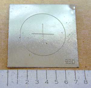 The typical QQI shim a metalic sheet about 7cm by 7cm in area.