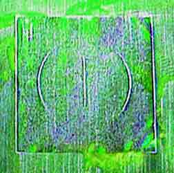 Magnetic particle testing of the QQI shim shows the orientation of the magnetic field by showing the direction of the visible indications