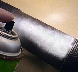 Nonaqueous developers are often sprayed from a can directly onto the part.