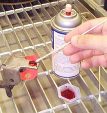 Liquid penetrant inspection can often be performed by hand with a swab.