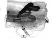 An X-ray image of items inside of a bag.